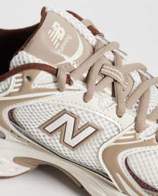 New Balance 530 sneakers in white and brown